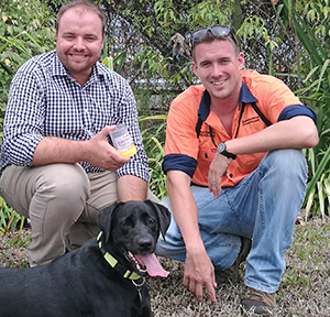 Our outreach officer Reece Pianta is shown the ropes with electric ant sniffer dog Eden and her handler.